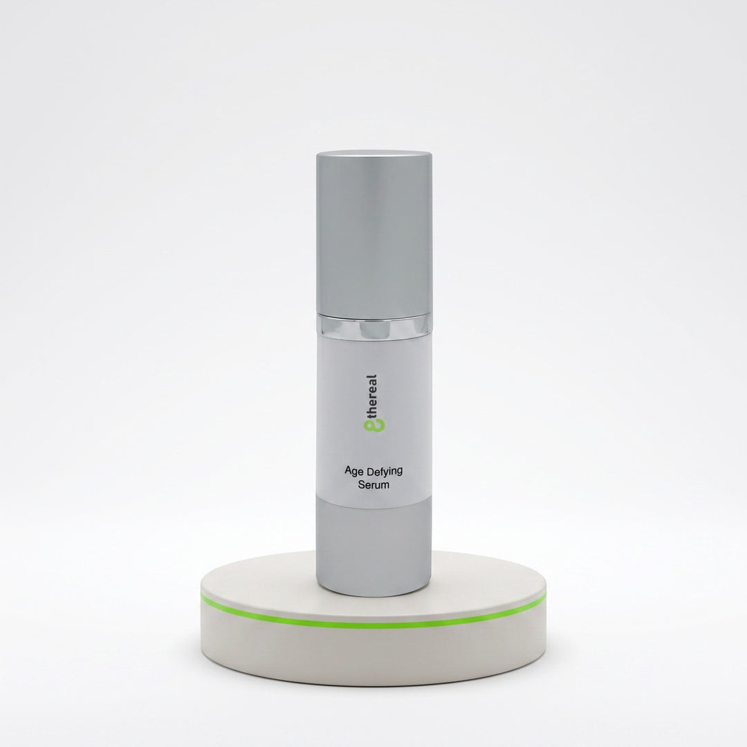 8thereal Age-Defying Facial Serum in a sleek silver pump bottle displayed on a minimalist white pedestal.