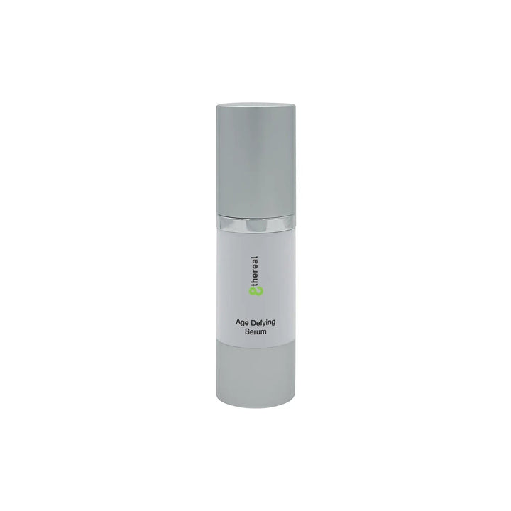 8thereal Age-Defying Facial Serum in a sleek white and silver pump bottle for hydrating and firming skin.