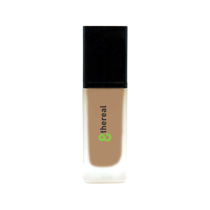 8thereal All-Day Wear Foundation SPF in a sleek glass bottle with a black cap, offering buildable coverage.