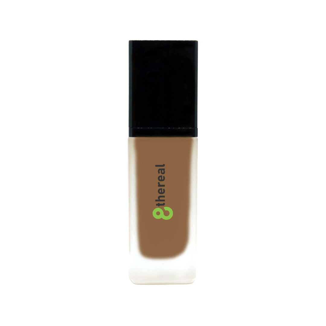 8thereal All-Day Wear Foundation SPF in a glass bottle with a black cap, providing buildable, natural coverage.