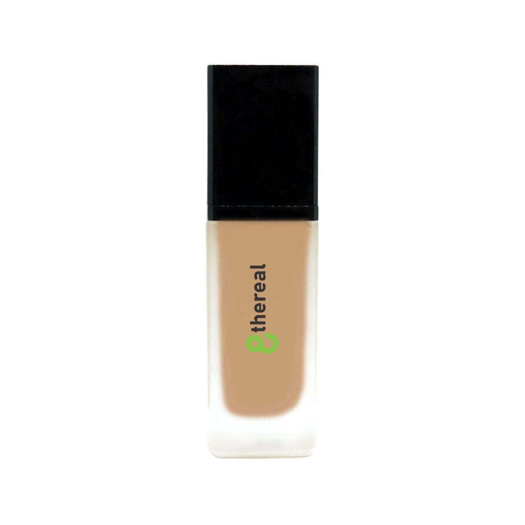 8thereal All-Day Wear Foundation SPF in a sleek glass bottle with a black cap, providing buildable coverage.