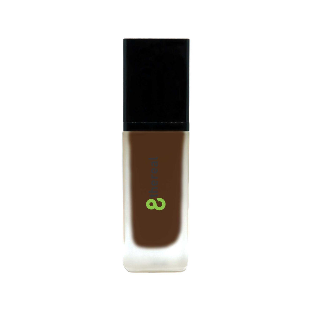 8thereal All-Day Wear Foundation SPF in a dark shade, featuring a sleek glass bottle with a black cap.