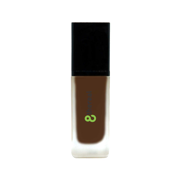 8thereal All-Day Wear Foundation SPF in a dark shade, featuring a sleek glass bottle with a black cap.