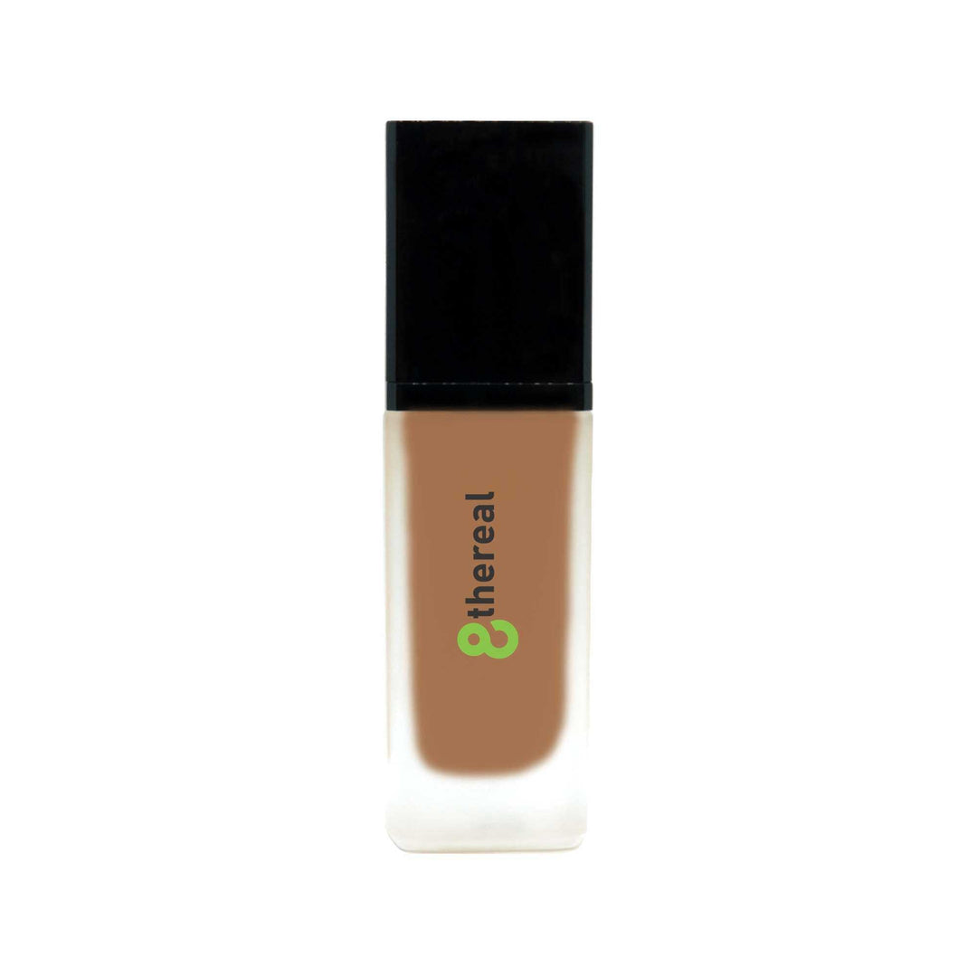 8thereal All-Day Wear Foundation SPF in a sleek glass bottle with a black cap, providing buildable coverage.