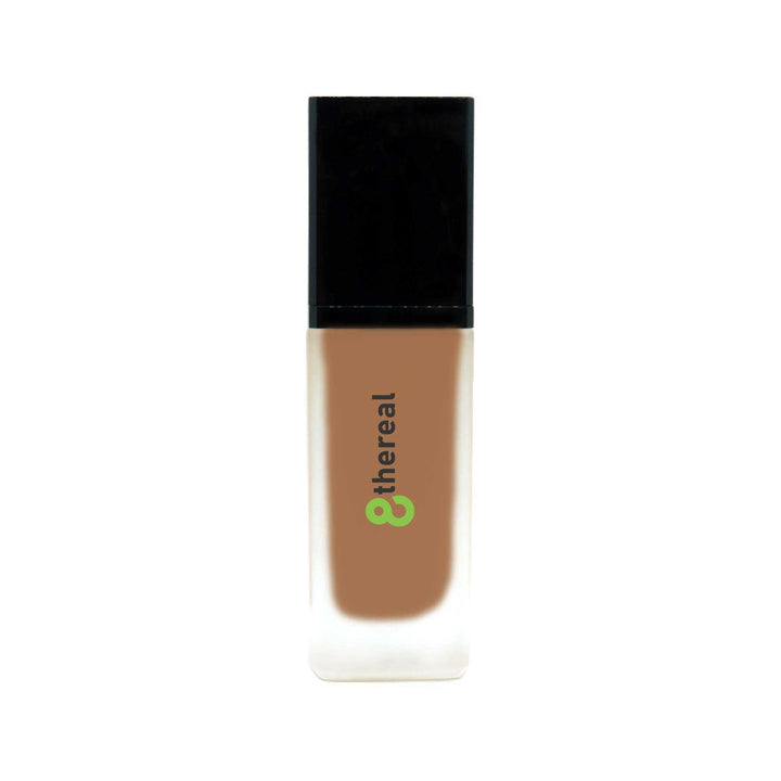 8thereal All-Day Wear Foundation SPF in a sleek glass bottle with a black cap, providing buildable coverage.
