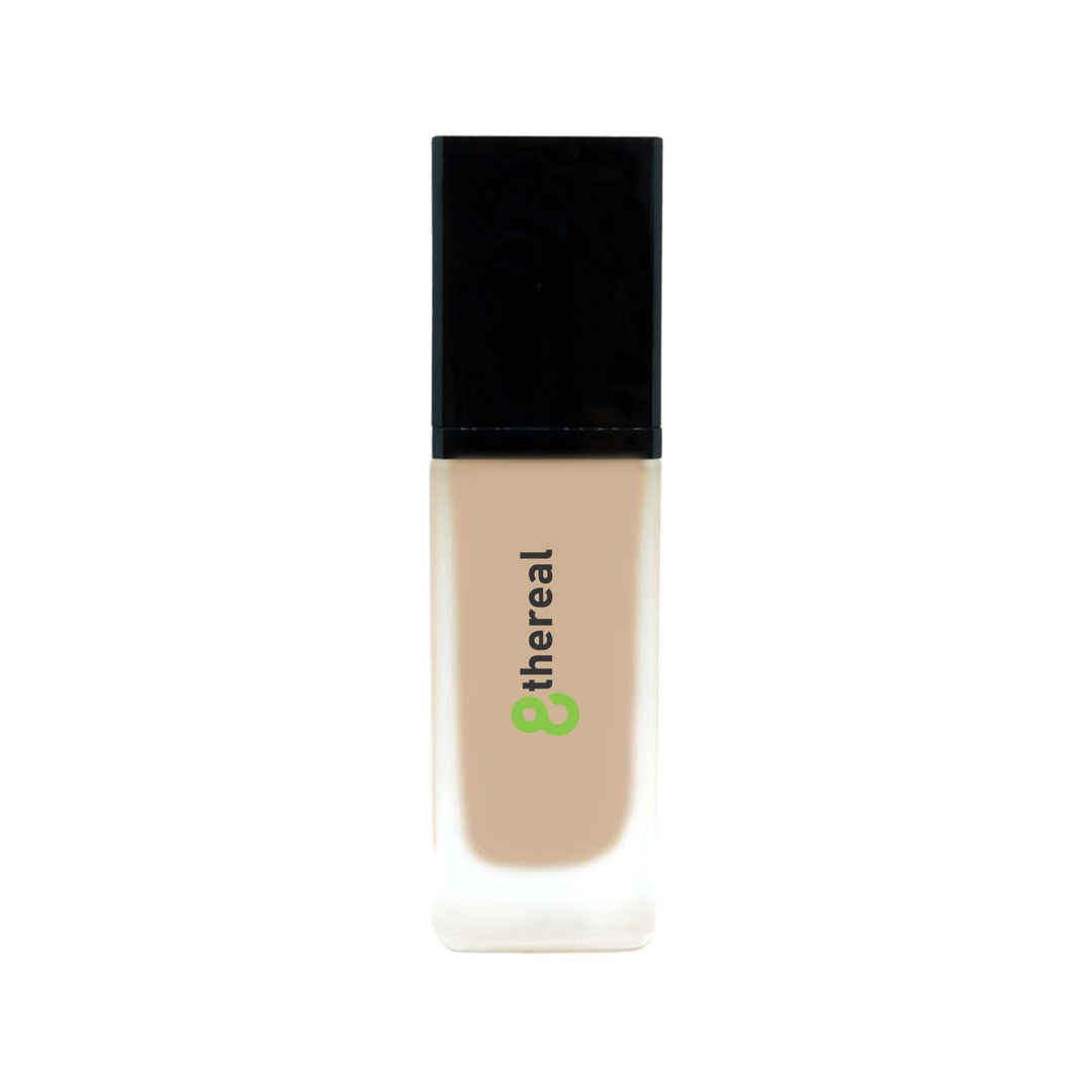 8thereal All-Day Wear Foundation SPF in a sleek glass bottle with a black cap, offering buildable coverage.