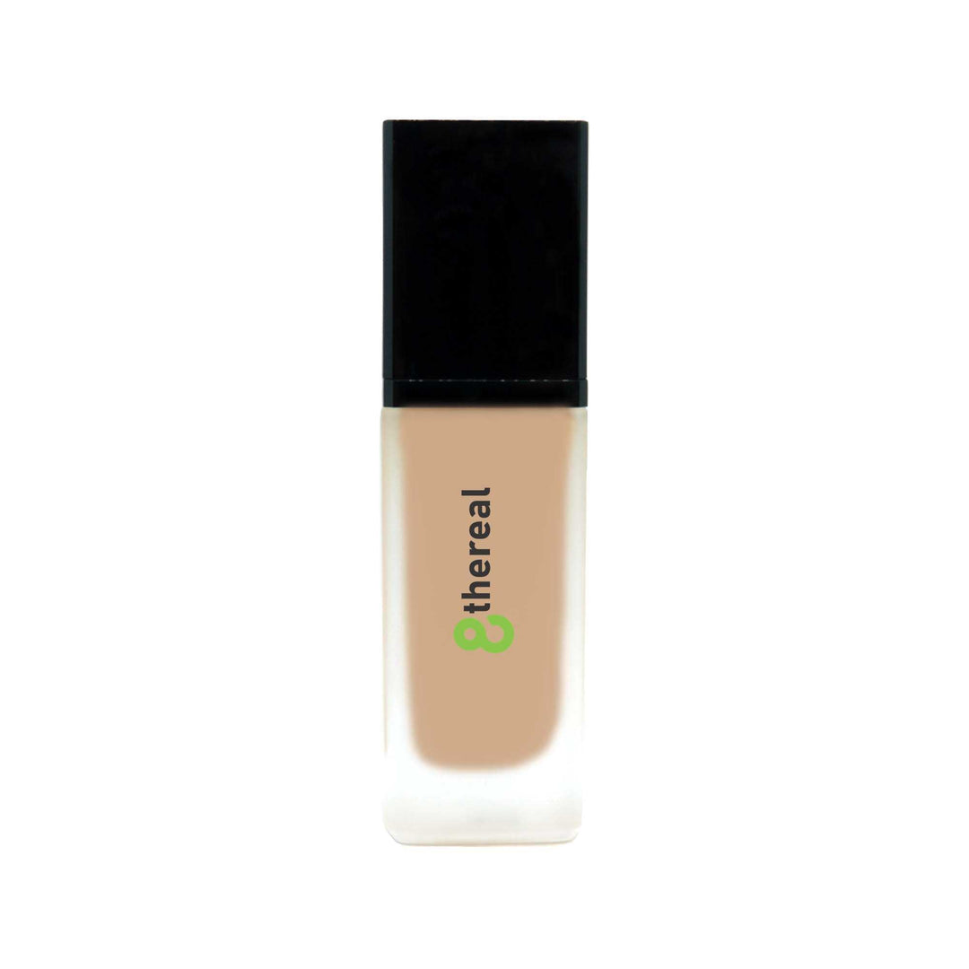 8thereal All-Day Wear Foundation SPF in a sleek glass bottle with a black cap, providing buildable, natural coverage.