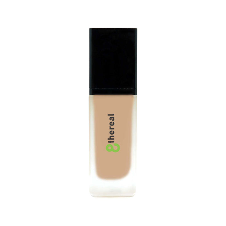 8thereal All-Day Wear Foundation SPF in a sleek glass bottle with a black cap, providing buildable, natural coverage.