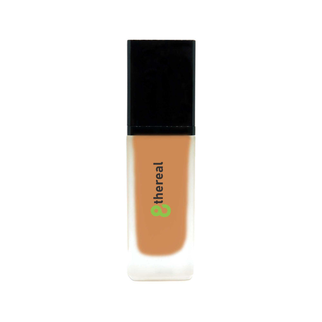 8thereal lightweight foundation with SPF in a frosted glass bottle with a black cap for natural buildable coverage