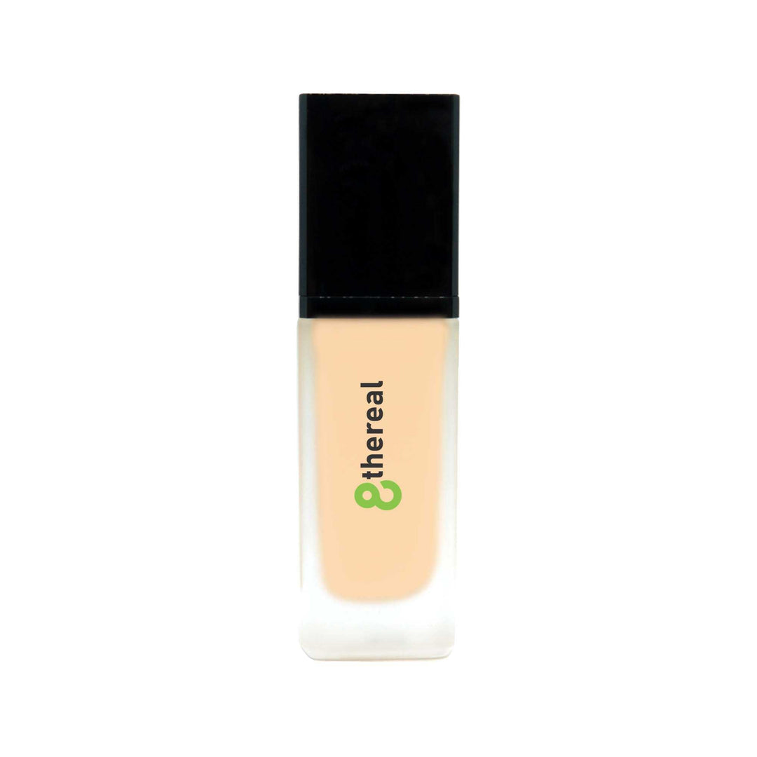 8thereal All-Day Wear Foundation SPF in a sleek glass bottle with a black cap, providing buildable coverage.
