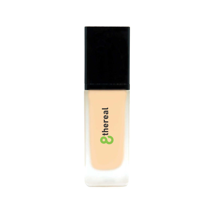 8thereal All-Day Wear Foundation SPF in a sleek glass bottle with a black cap, providing buildable coverage.
