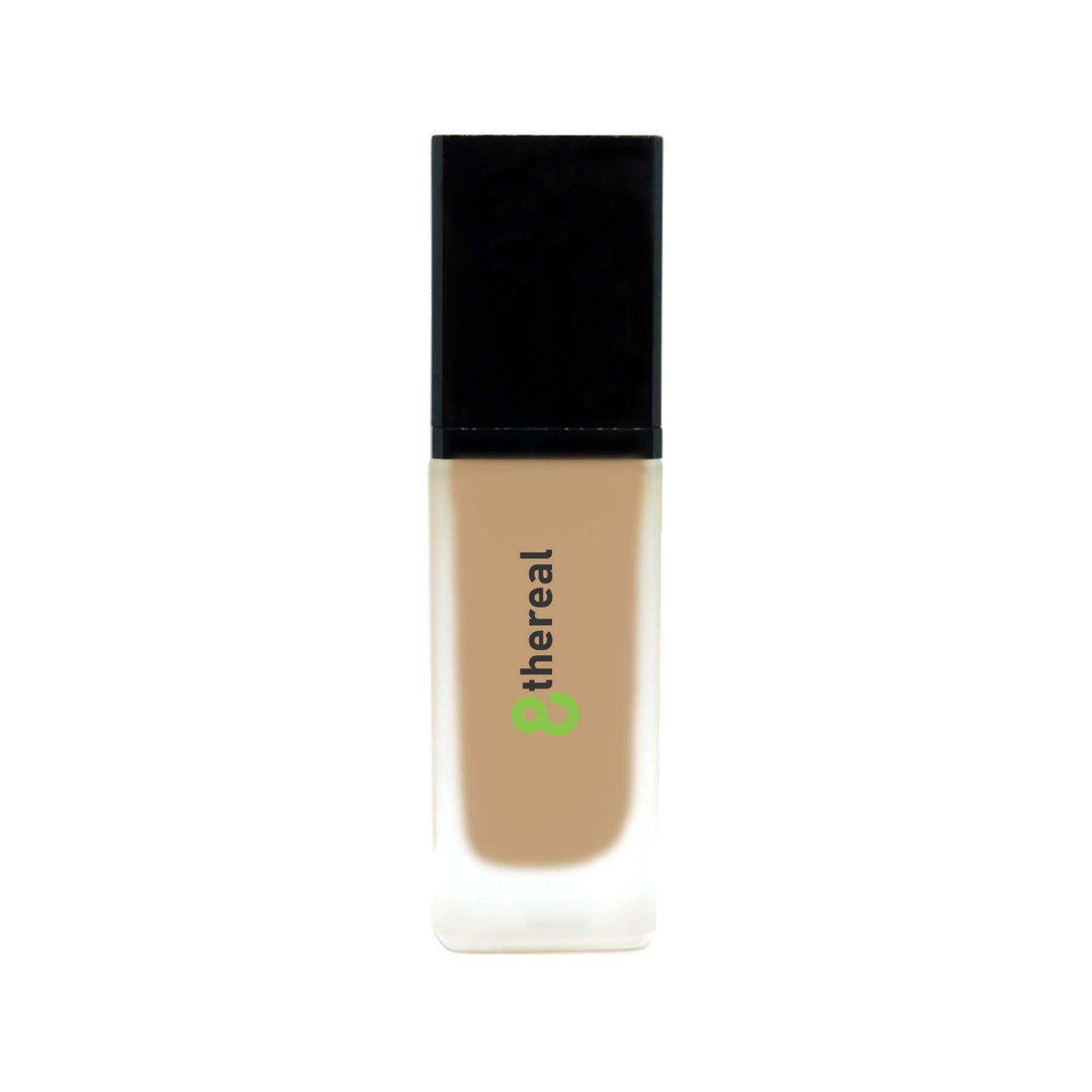 8thereal All-Day Wear Foundation SPF in a sleek glass bottle with a black cap, offering buildable, natural coverage.