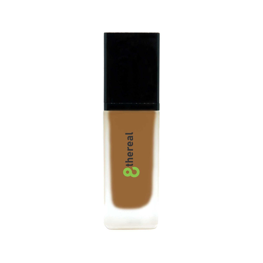8thereal All-Day Wear Foundation SPF in a sleek glass bottle with a black cap, offering buildable coverage.