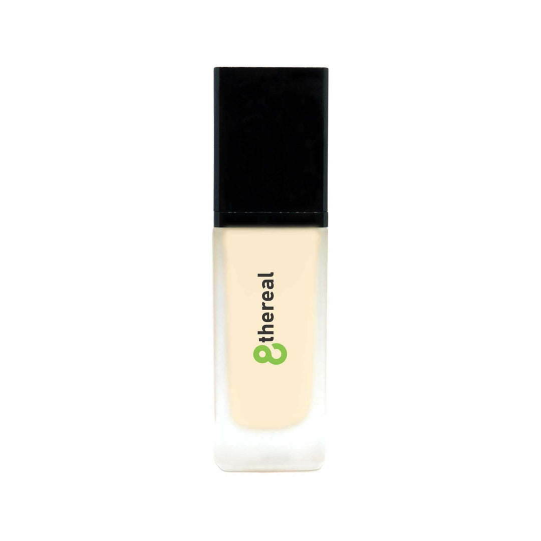 8thereal All-Day Wear Foundation SPF in a sleek glass bottle with a black cap, providing buildable coverage.