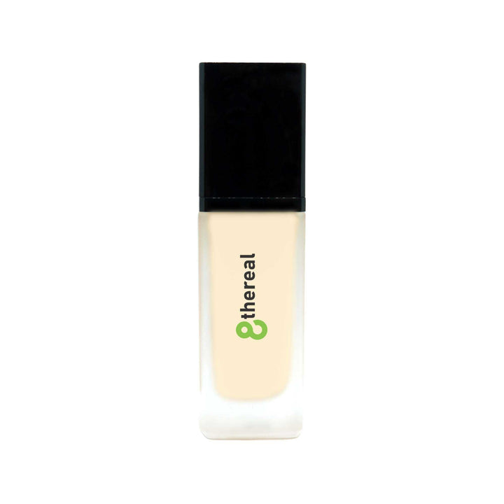 8thereal All-Day Wear Foundation SPF in a sleek glass bottle with a black cap, providing buildable coverage.