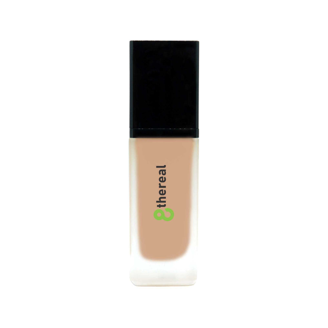 8thereal All-Day Wear Foundation SPF in a sleek glass bottle with a black cap, offering buildable coverage.