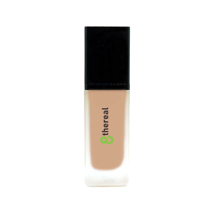 8thereal All-Day Wear Foundation SPF in a sleek glass bottle with a black cap, offering buildable coverage.