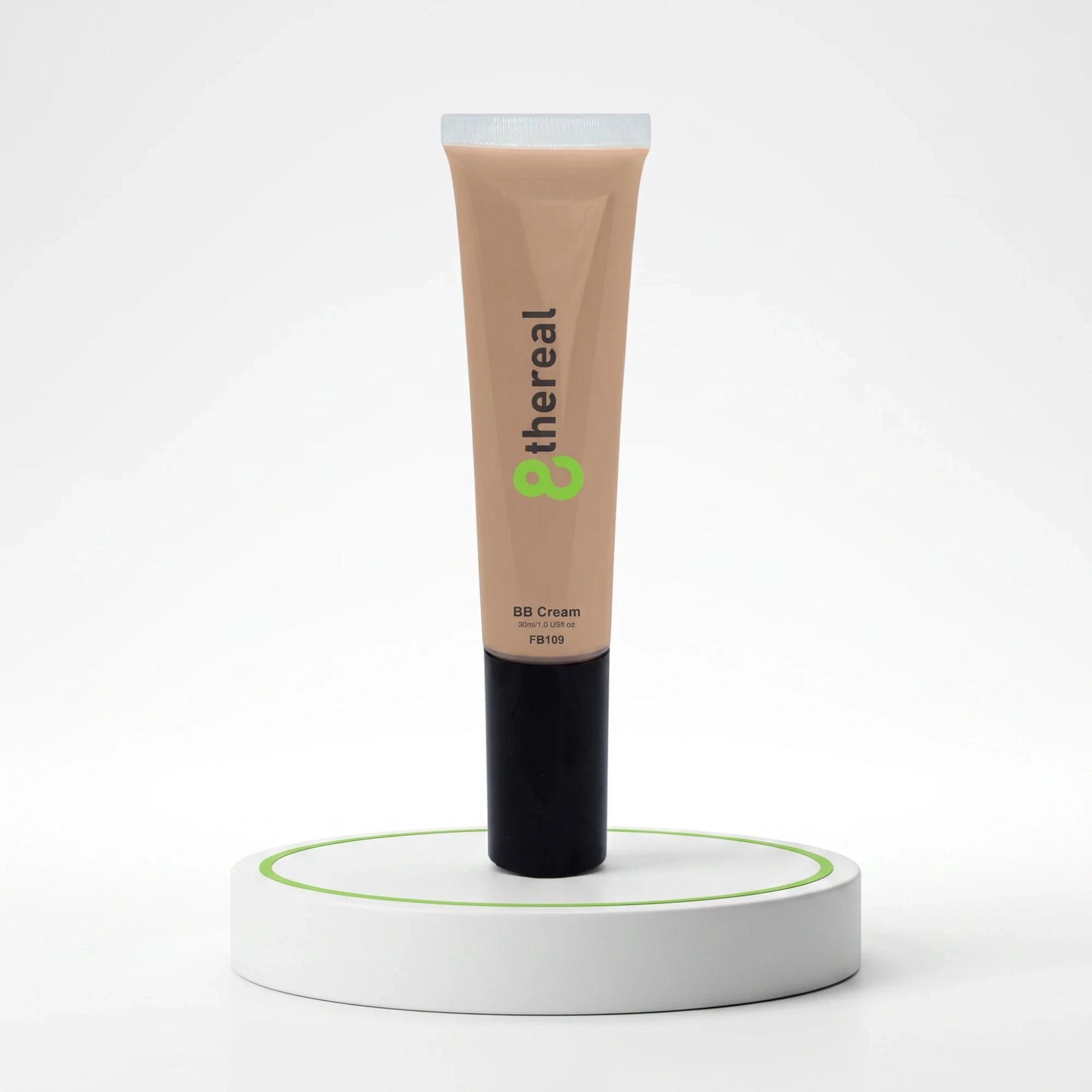 8thereal Everyday Glow BB Cream in a beige tube with a black cap, displayed upright on a white circular pedestal.