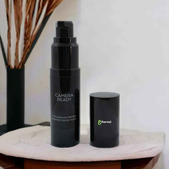 8thereal Camera-Ready skin smoothing face primer in a black pump bottle with a matching cap on a white surface.
