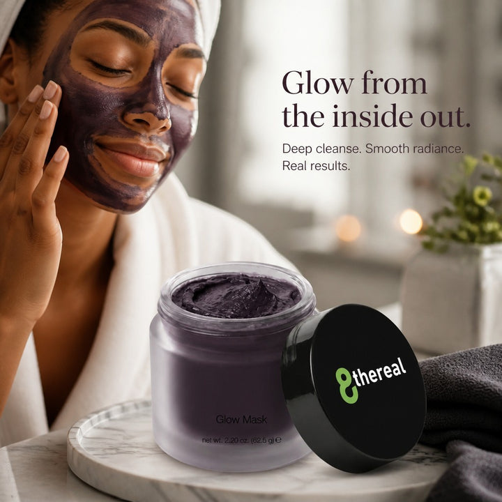 8thereal Deep-Cleansing Glow Mask in a glass jar next to a woman applying the dark charcoal face mask for radiant skin.
