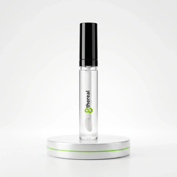 8thereal clear volumizing lip plumper gloss in a sleek tube with a black cap on a white display stand.