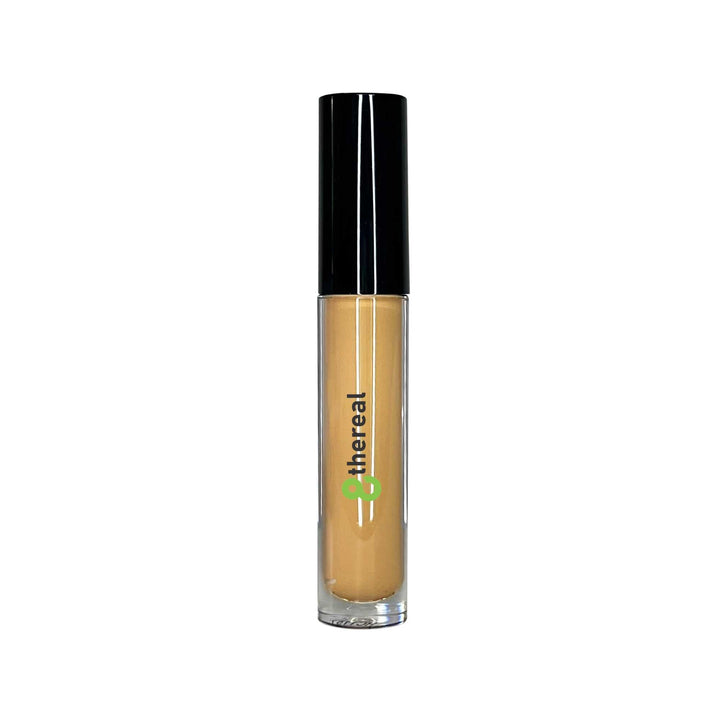 8thereal cream concealer in a clear tube with a black cap and doe-foot applicator for full coverage makeup