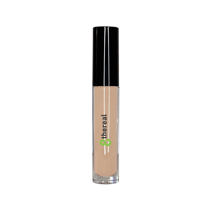 8thereal cream concealer in a clear tube with a black cap, featuring a precision doe-foot applicator for coverage.