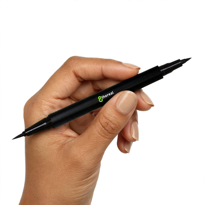 8thereal dual tip eyeliner pen in black held in a hand, showing both the fine brush and bold felt tips.
