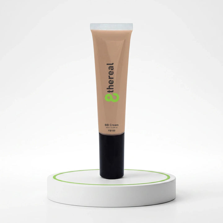 8thereal Everyday Glow BB Cream in a beige squeeze tube standing upright on a white circular display stand.