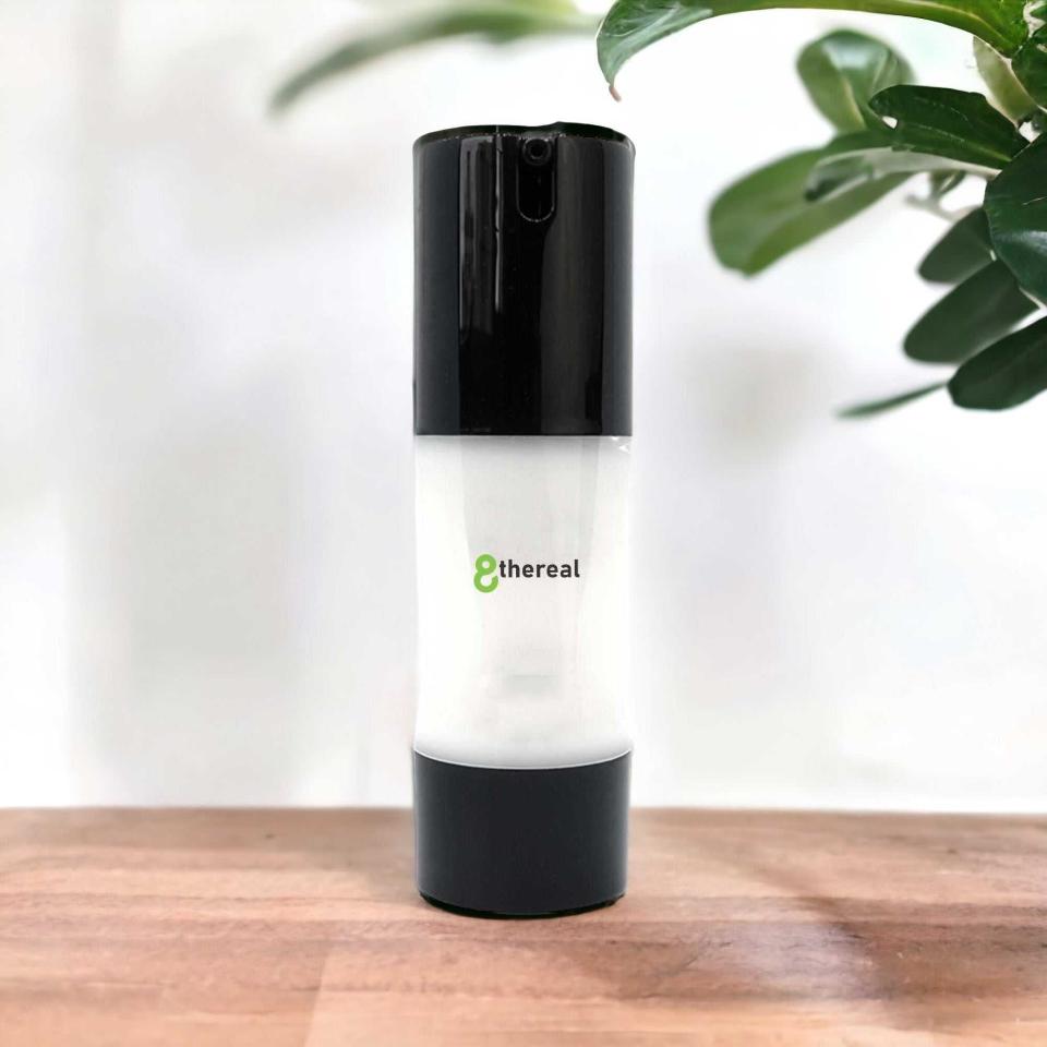 8thereal Extreme Moisture Blend face cream in a sleek white and black pump bottle on a wooden surface.