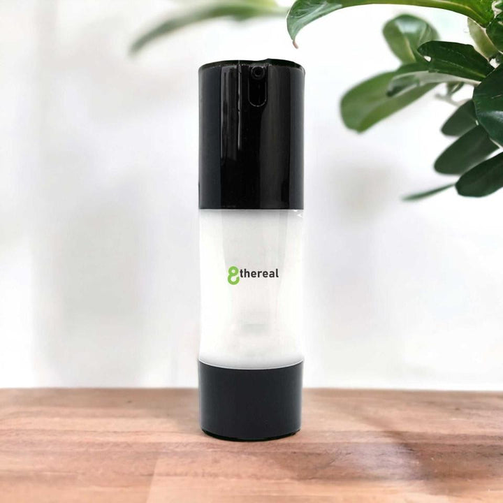 8thereal Extreme Moisture Blend face cream in a sleek white and black pump bottle on a wooden surface.