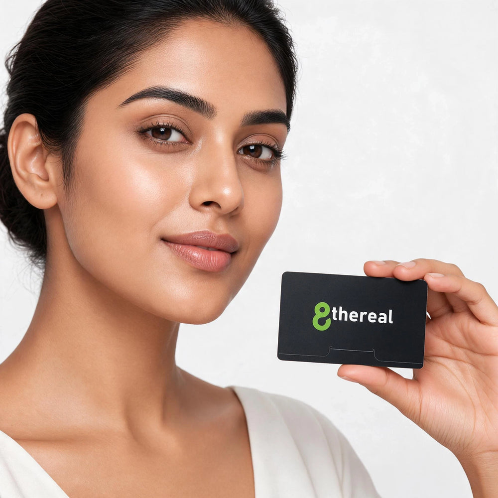 A woman holding a black 8thereal facial blotting paper pack for oil control and a fresh complexion.