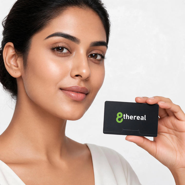 A woman holding a black 8thereal facial blotting paper pack for oil control and a fresh complexion.