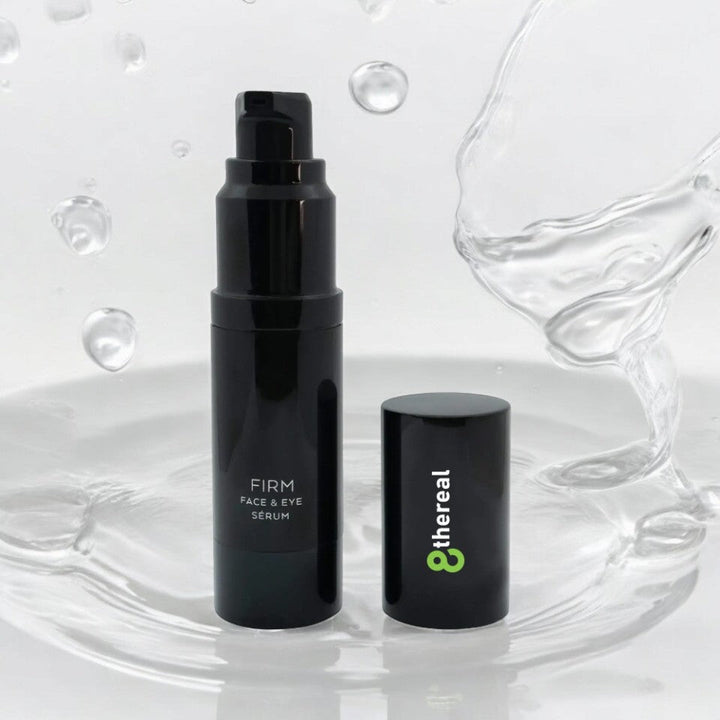 8thereal Firming Face & Eye Comfort Serum in a sleek black pump bottle with cap, surrounded by refreshing water splashes.