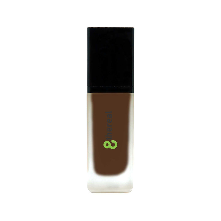 8thereal All-Day Wear Foundation SPF in a sleek glass bottle with a black cap, providing buildable coverage.