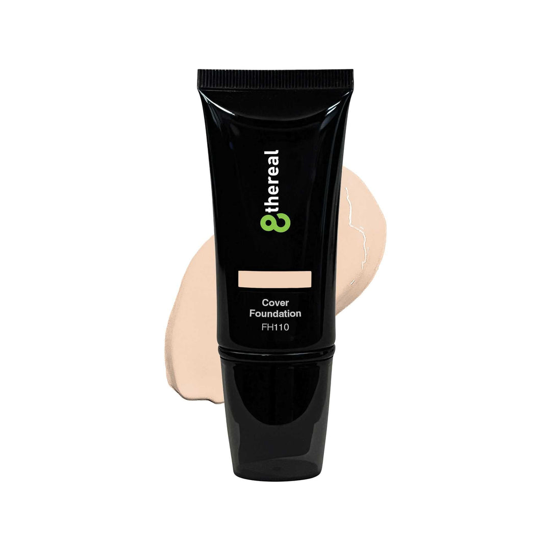 8thereal Skin-First full coverage foundation in a black squeeze tube with a beige liquid swatch behind it.
