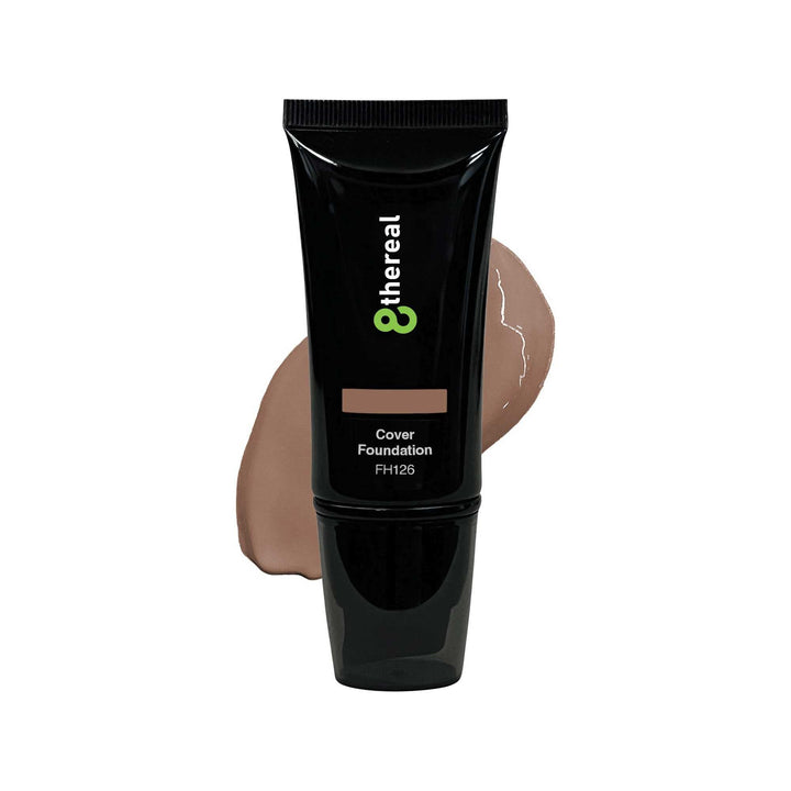 8thereal Skin-First full coverage foundation in a black squeeze tube with a beige product swatch behind it.