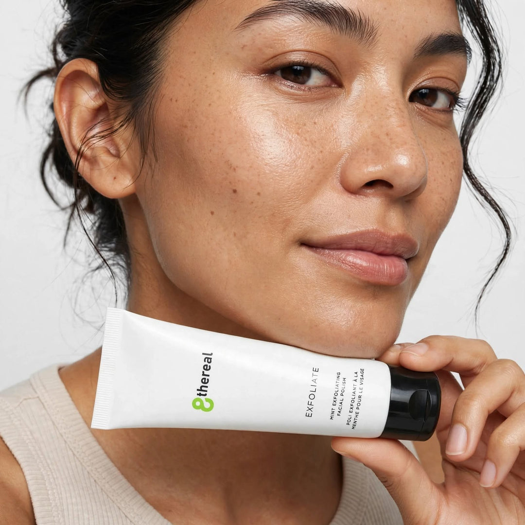 8thereal Gentle Refining Facial Polish held by a woman with glowing skin, showcasing the mint-infused exfoliating tube