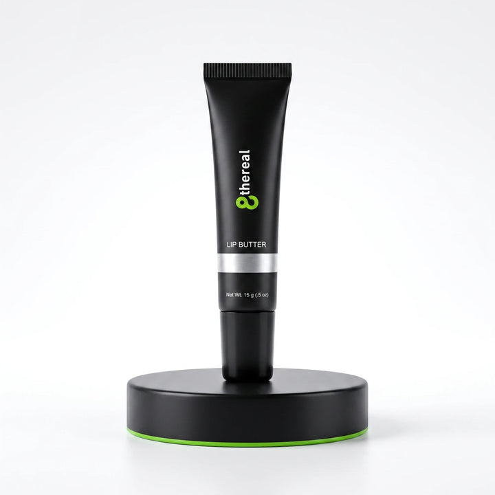 8thereal hydrating lip butter in a sleek black squeeze tube standing upright on a matching black display base.