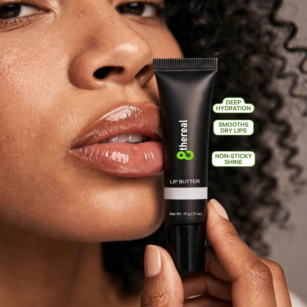 8thereal hydrating lip butter in a black tube held by a model with glossy, smooth lips and natural makeup.