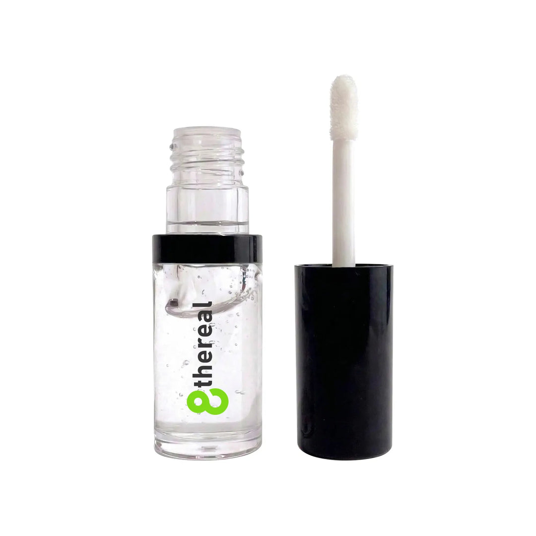 8thereal hydrating lip oil in a clear bottle with a black cap and applicator wand for a glossy non-sticky finish