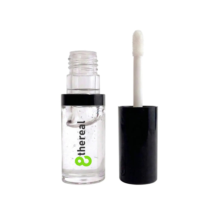 8thereal hydrating lip oil in a clear bottle with a black cap and applicator wand for a glossy non-sticky finish
