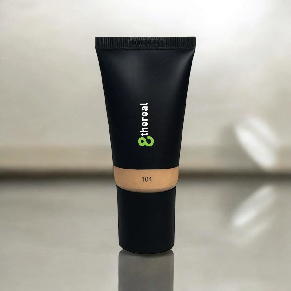 8thereal hydrating tinted moisturizer in shade 104, a lightweight vegan formula in a sleek black squeeze tube.