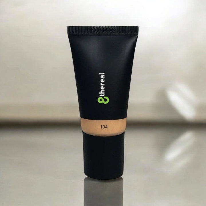 8thereal hydrating tinted moisturizer in shade 104, a lightweight vegan formula in a sleek black squeeze tube.