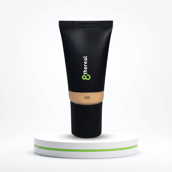 8thereal Hydrating Tinted Moisturizer in shade 109, a lightweight vegan formula in a black squeeze tube on a pedestal.