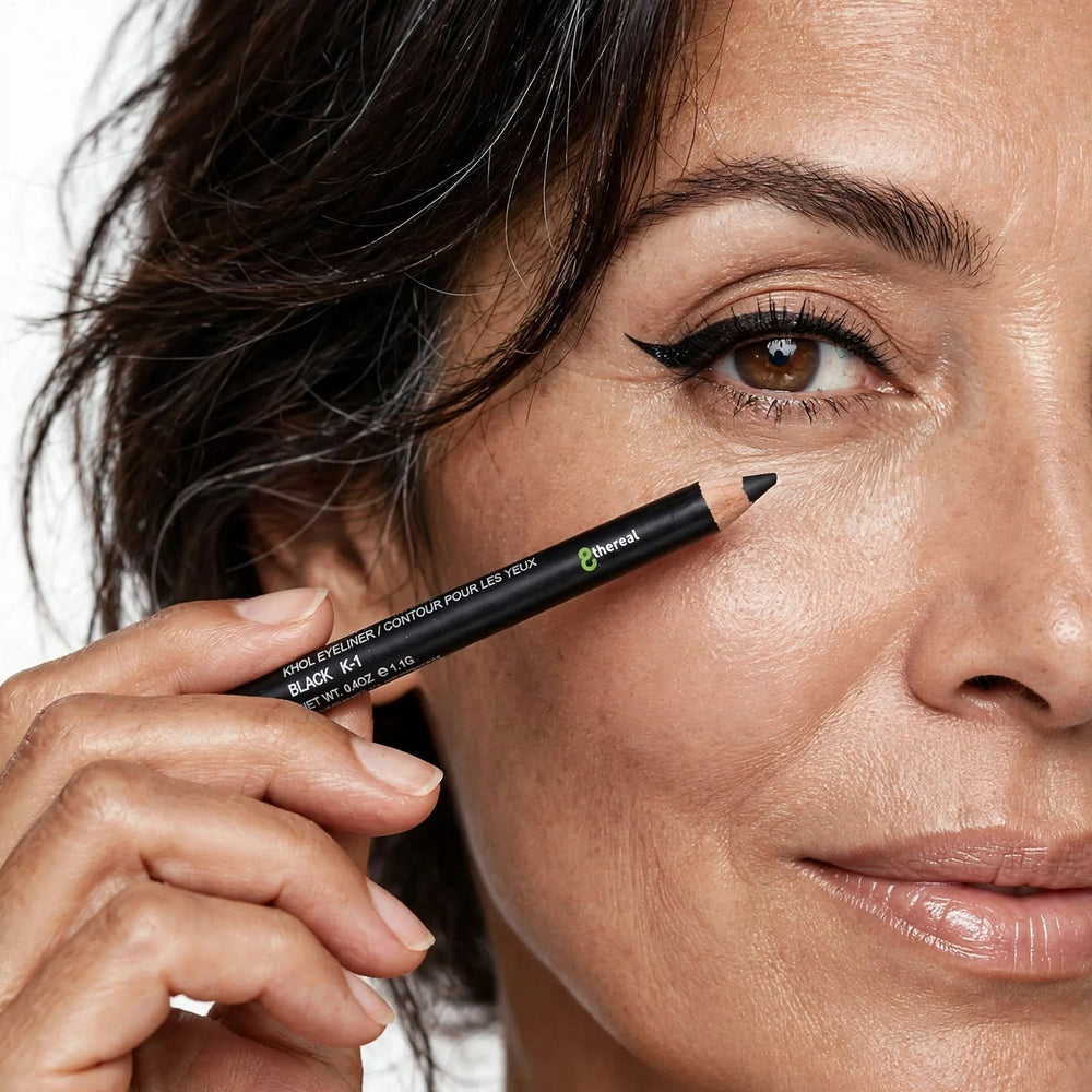 8thereal Soft-Define Khol Eyeliner pencil in black being applied by a woman for a precise winged eye look