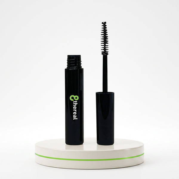 8thereal Lash Rejuvenator clear serum in a black tube with a spoolie wand applicator on a white display stand.