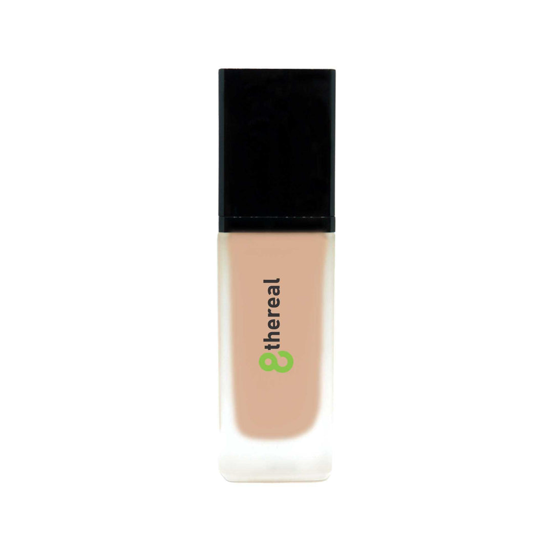 8thereal All-Day Wear Foundation SPF in a sleek glass bottle with a black cap, providing buildable coverage.