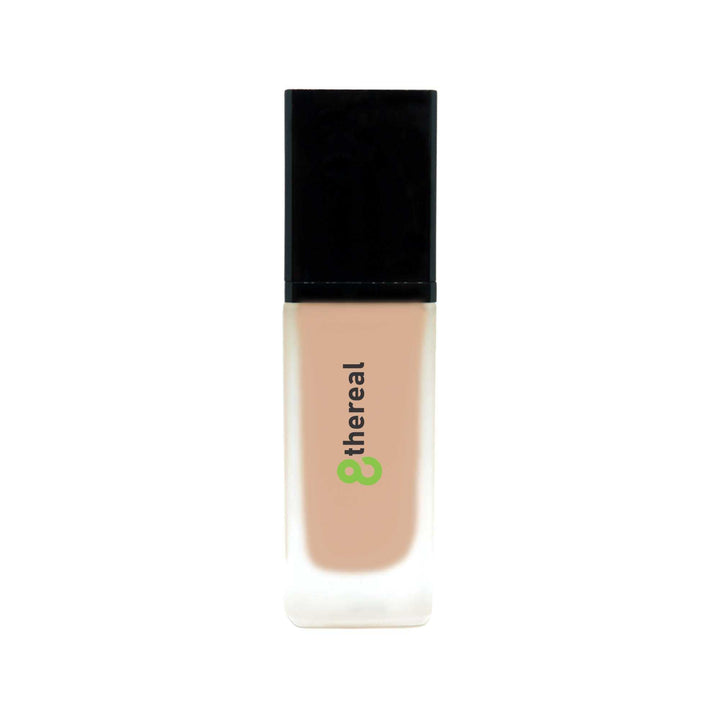 8thereal All-Day Wear Foundation SPF in a sleek glass bottle with a black cap, providing buildable coverage.