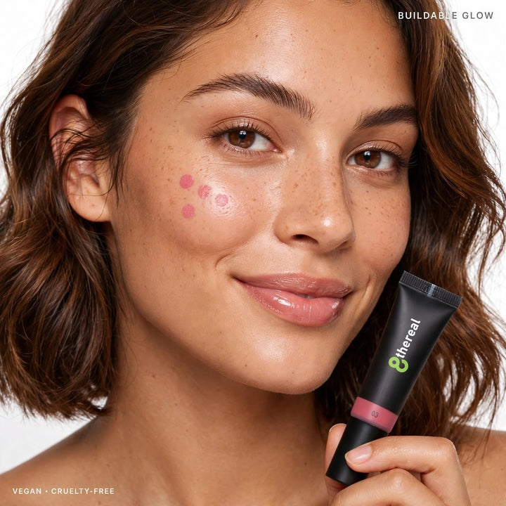 8thereal Soft Flush liquid blush applied as dots on a model's cheek, holding the hydrating vegan tube packaging.